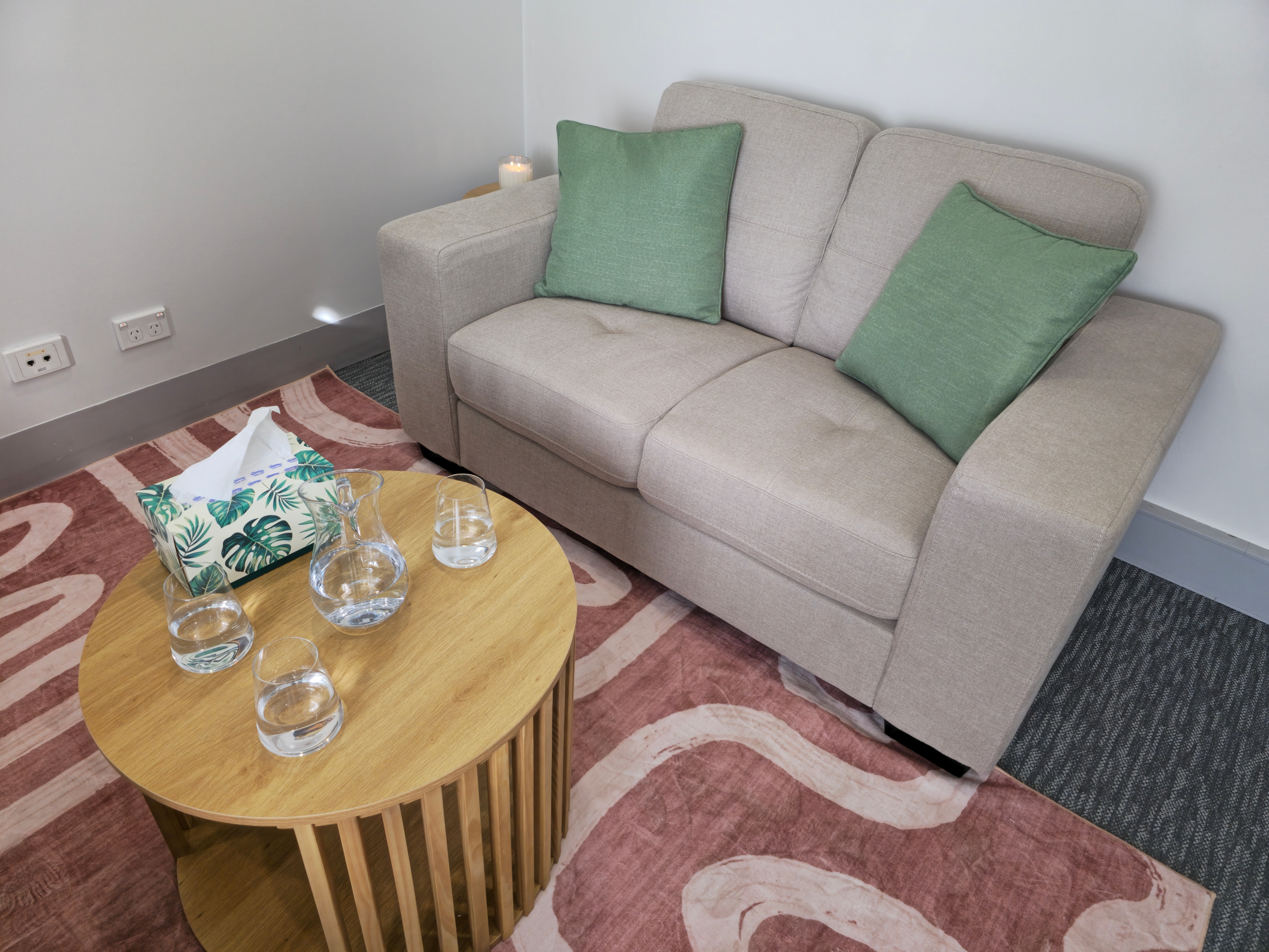 Couch and table at Untherapy Room Hobart counselling space